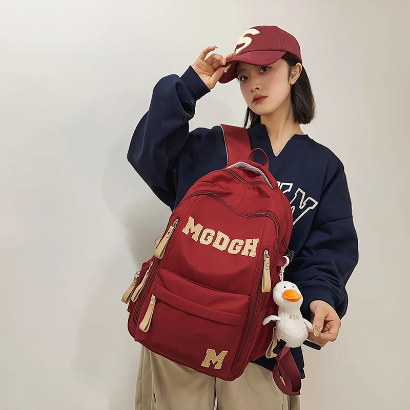 高中学生大学生减负书包小众酒红色背包初中生高中生大容量双肩包