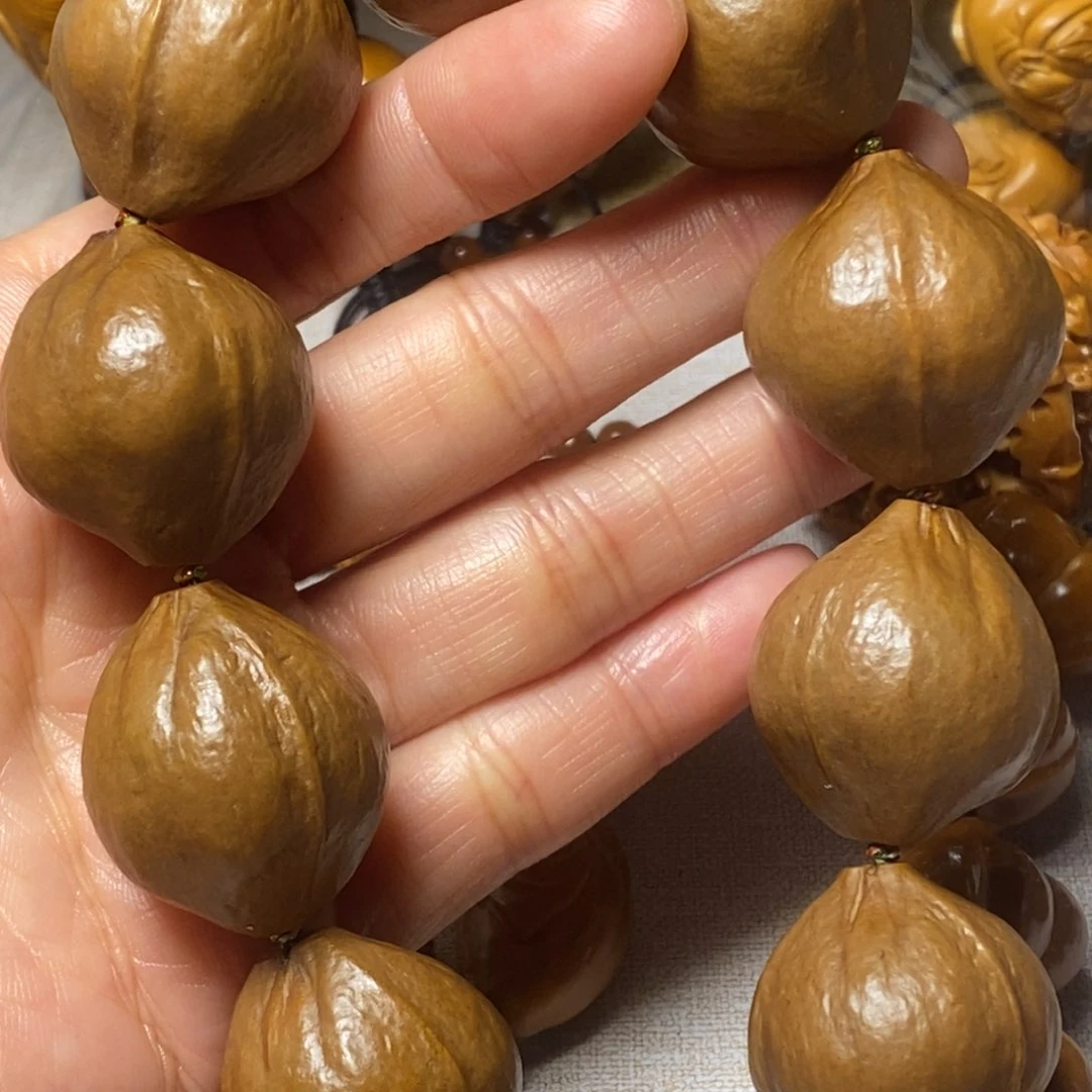 橄榄核手串/手链春****)包衣大素核