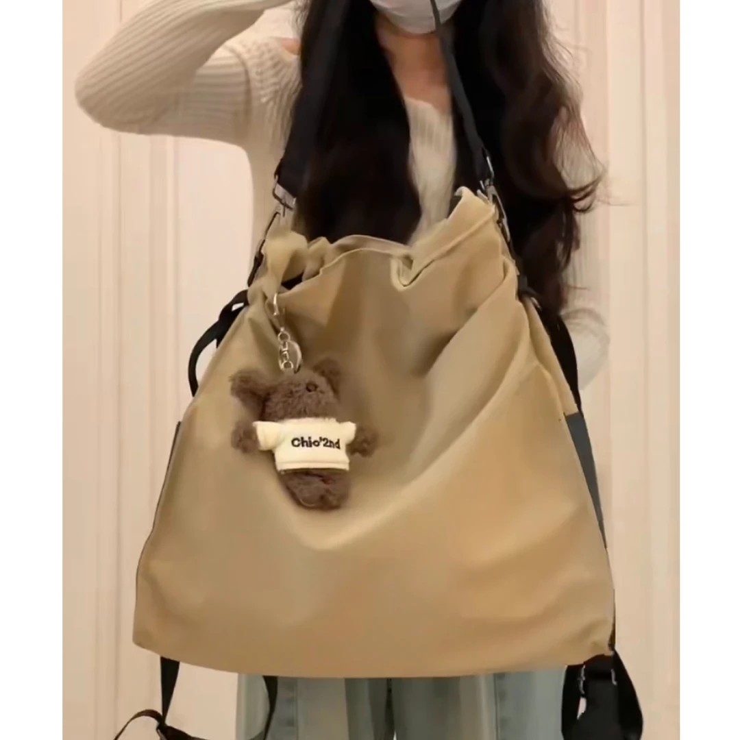 大容量通勤束口双肩包包女式2025新款日常百搭休闲防水单肩托特包