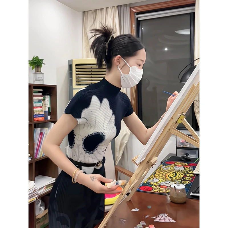 MARIE.COCO夏季新款半高领短袖上衣气质设计感高腰碎花半身裙套装