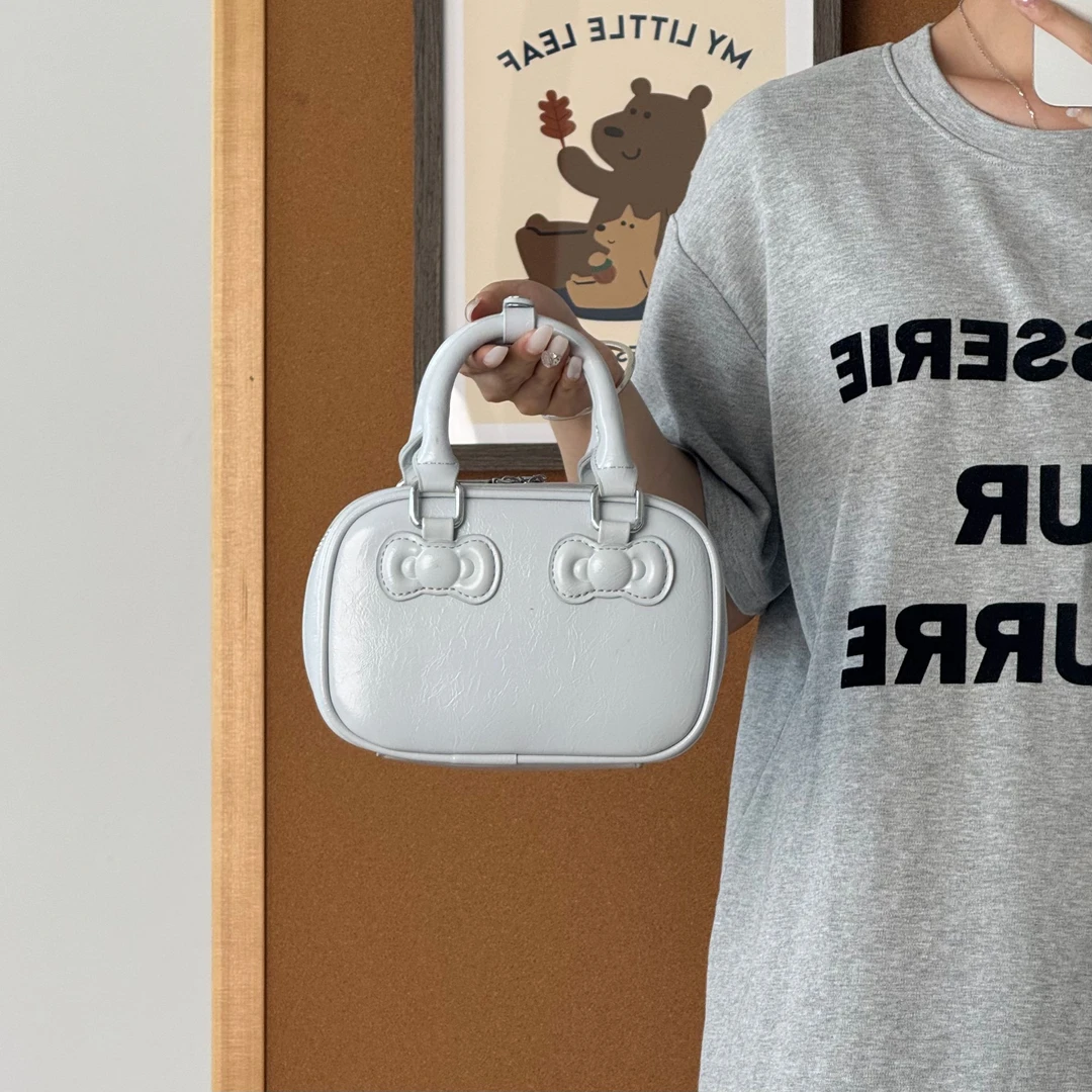 一张同学【长约18宽7高13 单位厘米】时尚手提单肩斜挎包C3940蓝