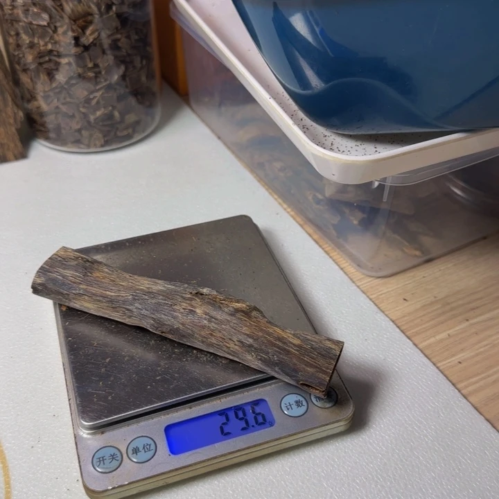 木平**乐海南油叶子手把件29克