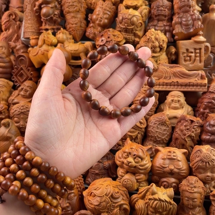 崖柏一物一拍手把件