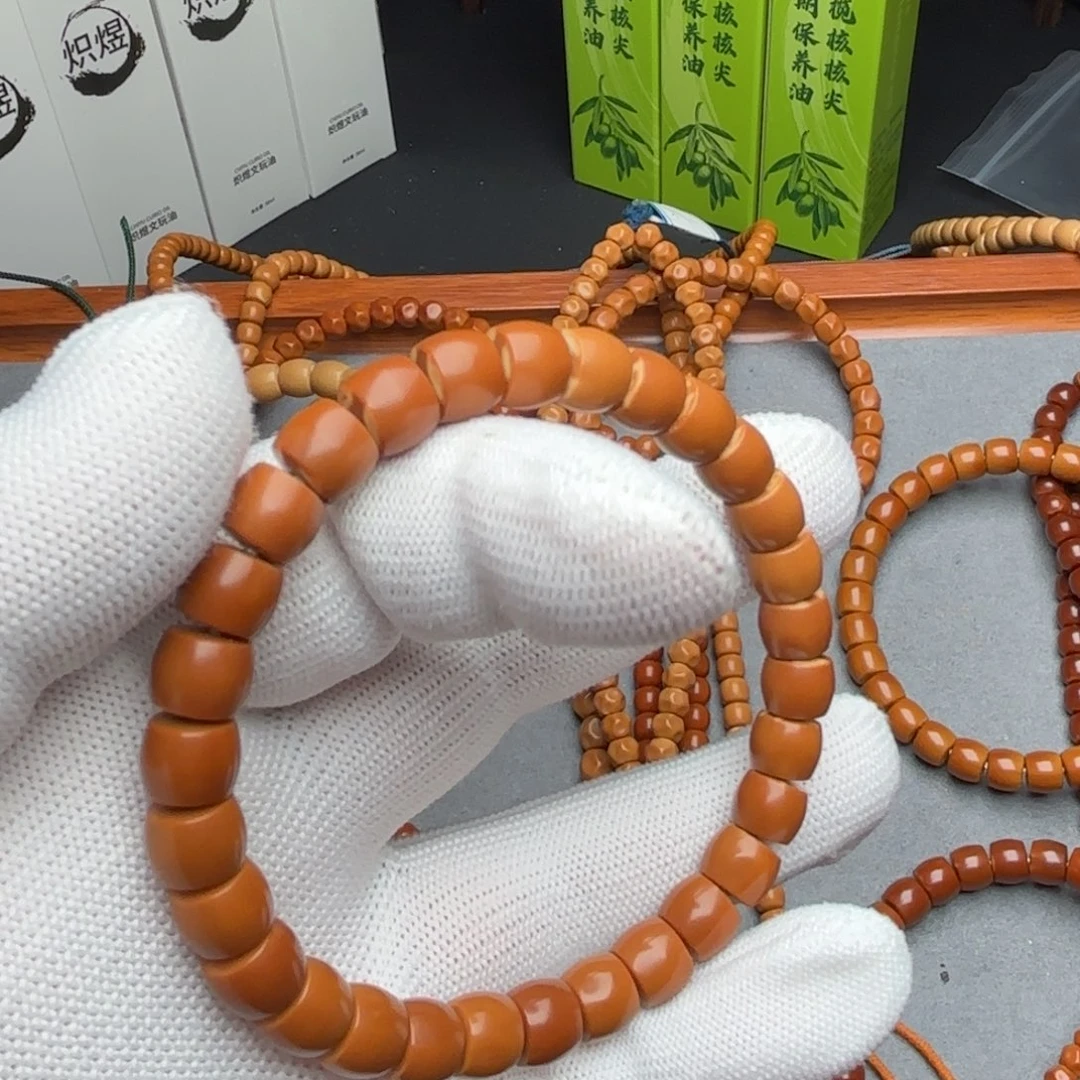 大****手串橄榄核老挝核尖单圈红料8.2直切