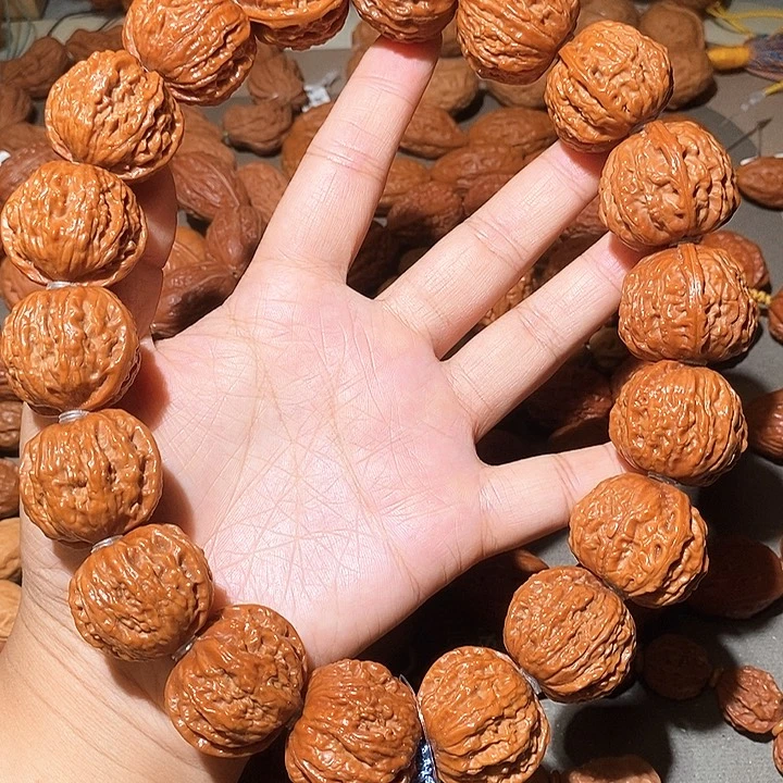 *****文玩核桃吊坠29尺流水纹手持