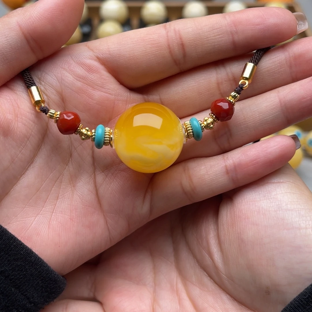 加***鲁琥珀未镶嵌裸石蜜蜡圆珠微瑕笑