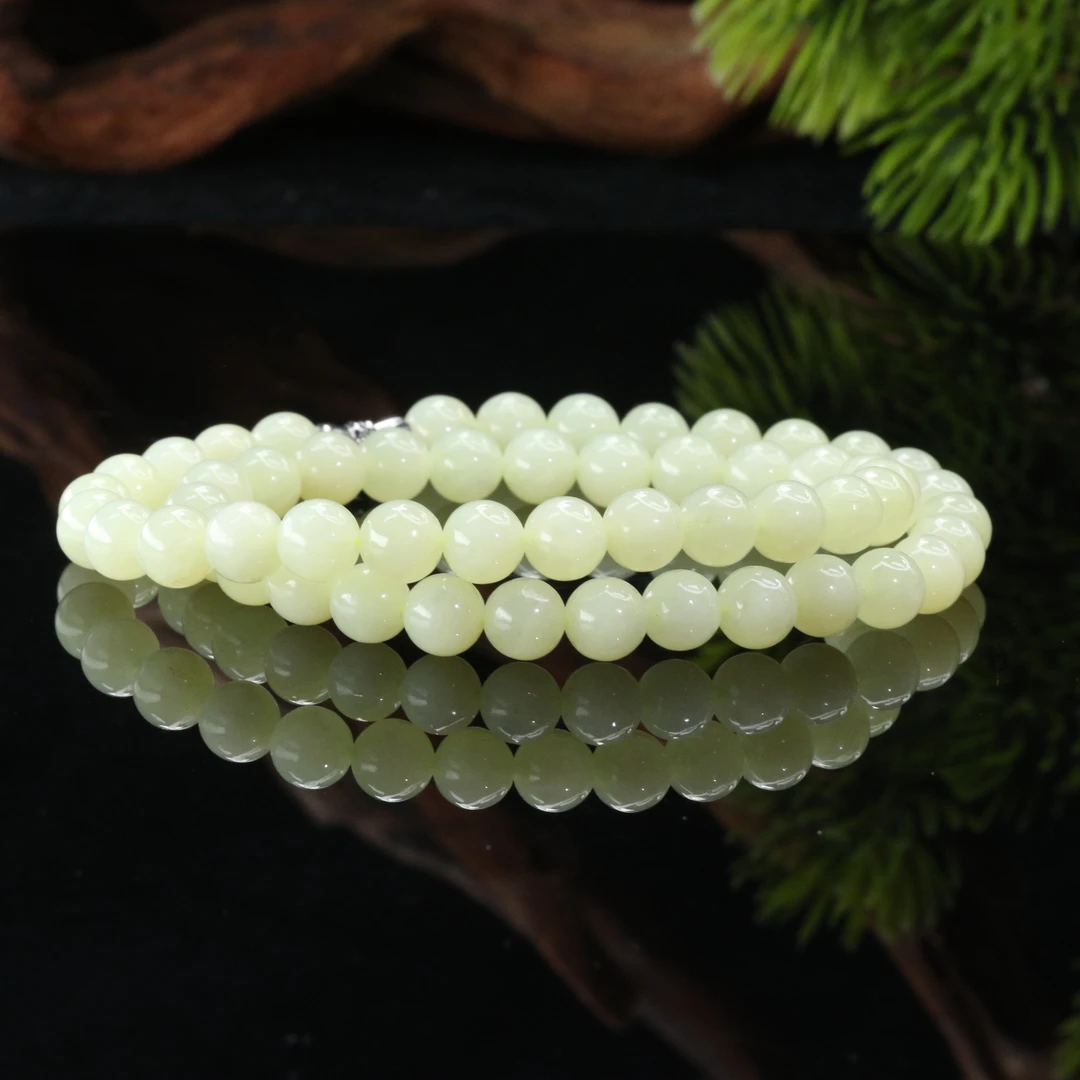 55和田玉若羌黄口长串/000163上海嘉禾拍卖