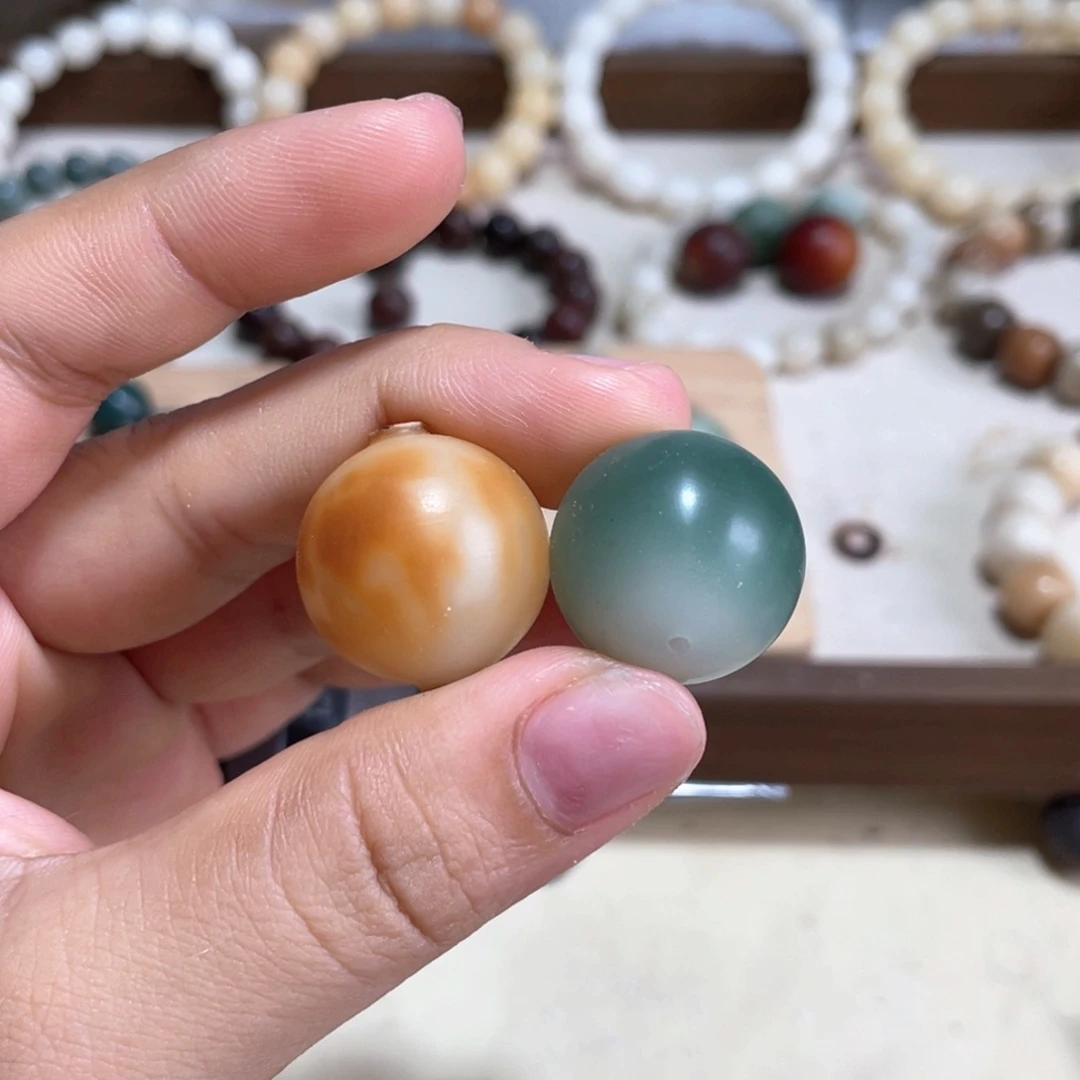 霡***恦吊坠菩提根/象牙果卡20阴皮料火烧云双拼圆珠