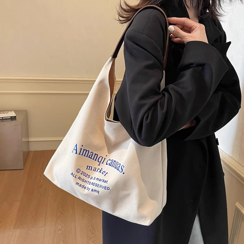韩版文艺慵懒字母单肩帆布腋下包2025新款休闲时尚百搭学生托特包