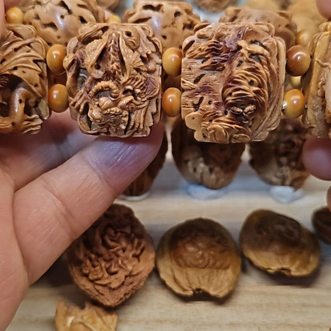 桃核纯手工雕刻山海经瑞兽手牌（9颗）