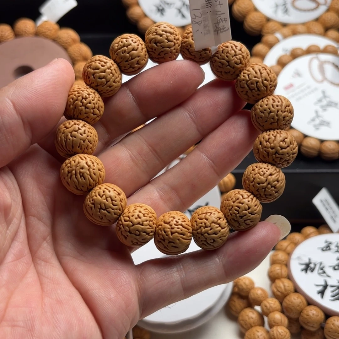 伏***提菩提籽类桃核苹果园手串精品