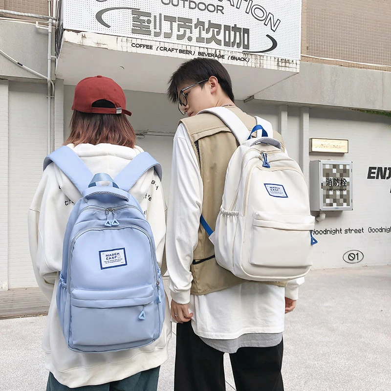 2025高中学生减负大容量书包男款护脊旅行初中女生大学生背包双肩