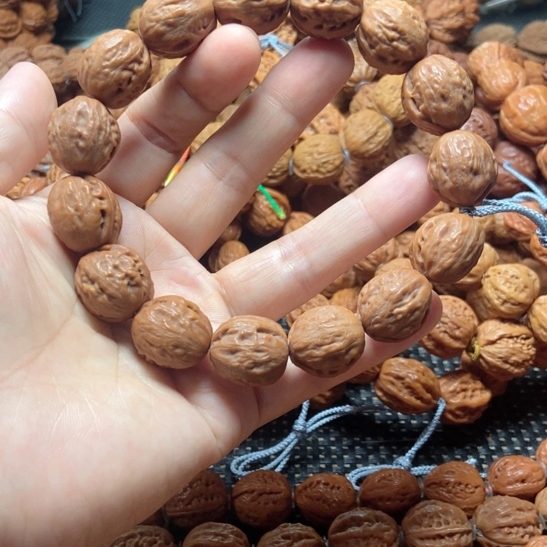 假***真桃核吊坠金豆子手串