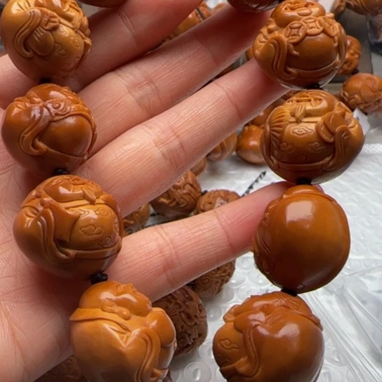 桃***子橄榄核手串橄榄雕工艺的