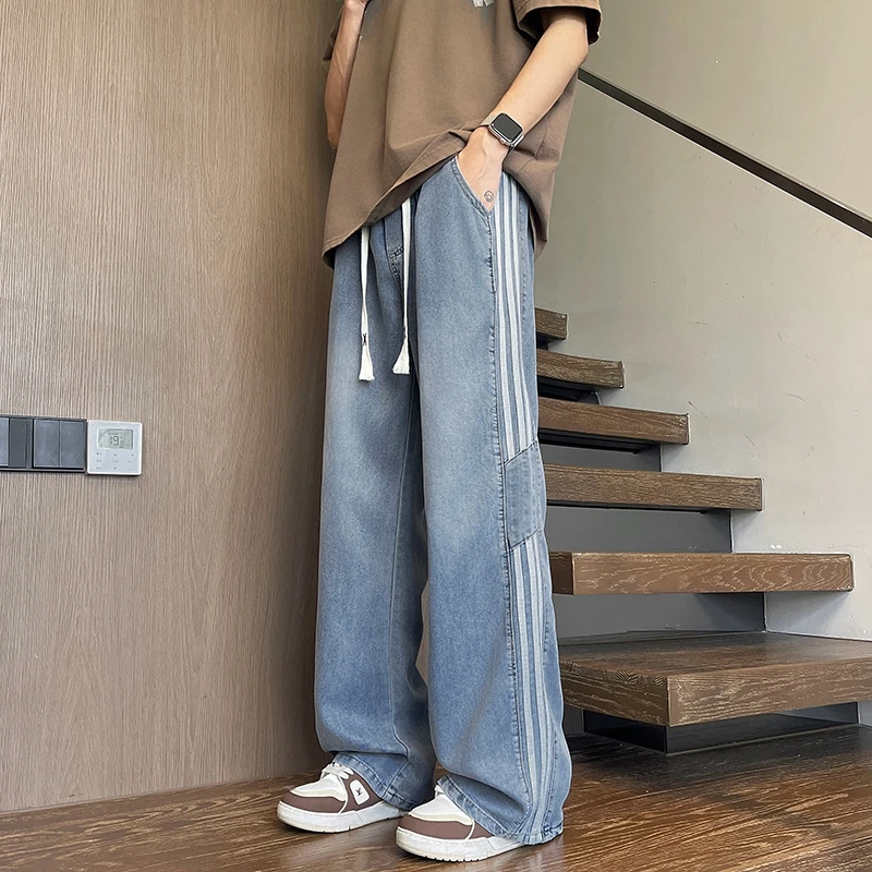 夏季薄款莱赛尔男士牛仔裤青少年潮流时尚宽松条纹冰丝休闲长裤子