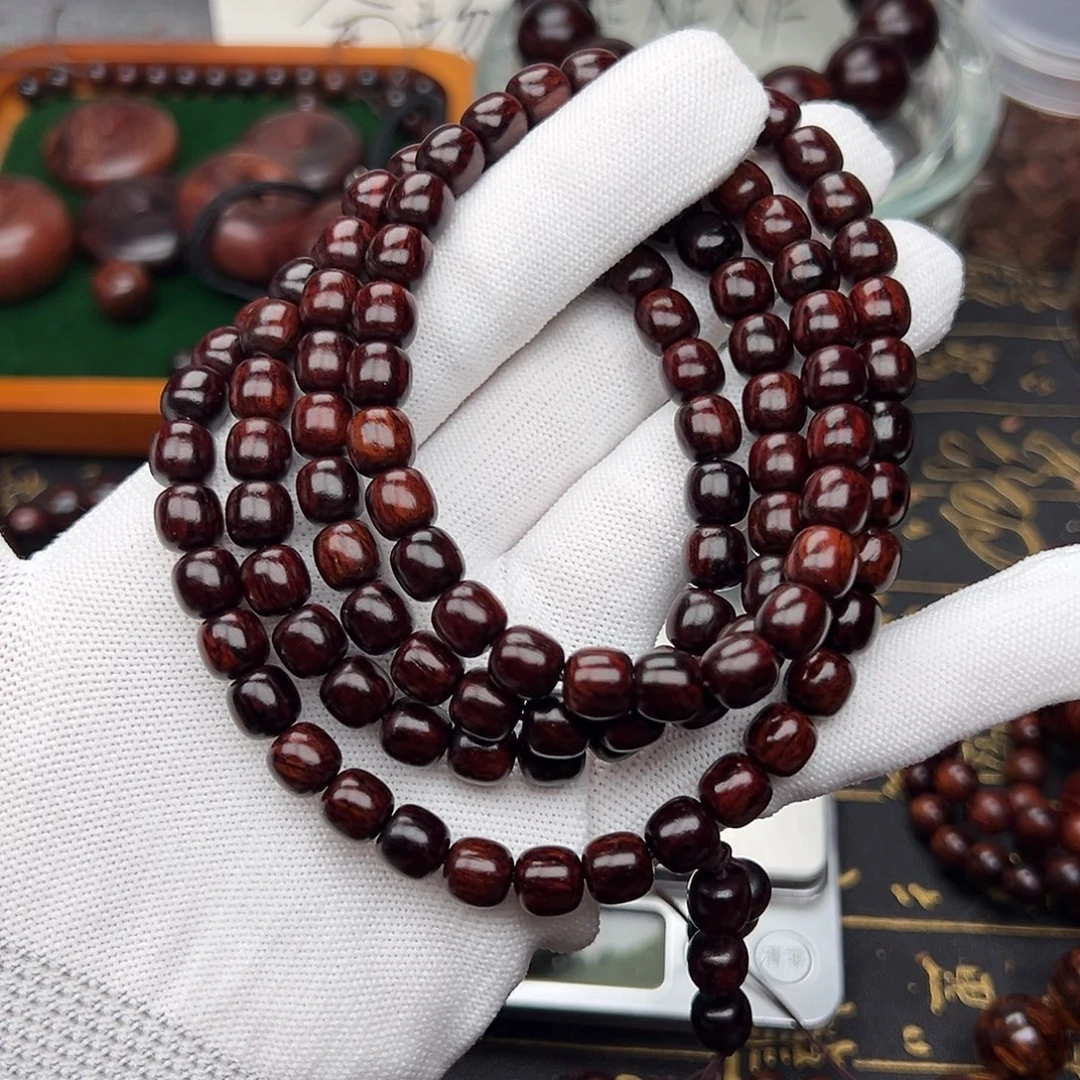 皓***空木0.8海南红降黑金满油108颗高货