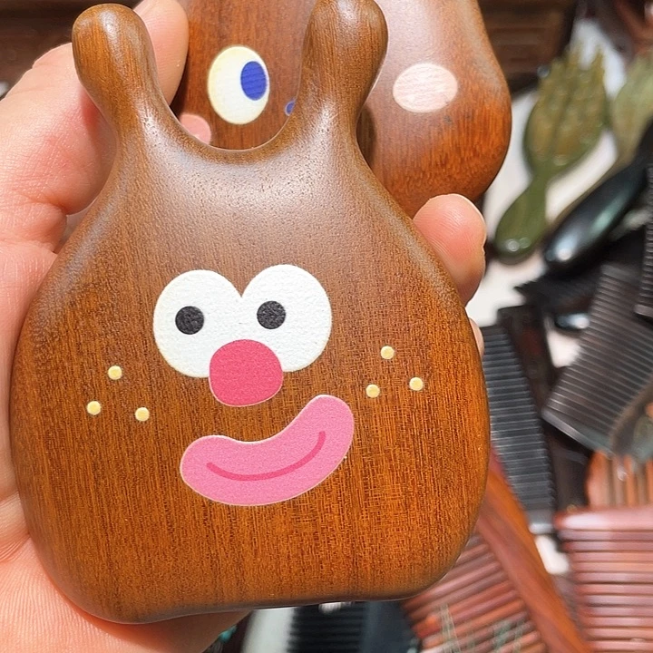 红酸枝木类K***吖气垫梳子两个