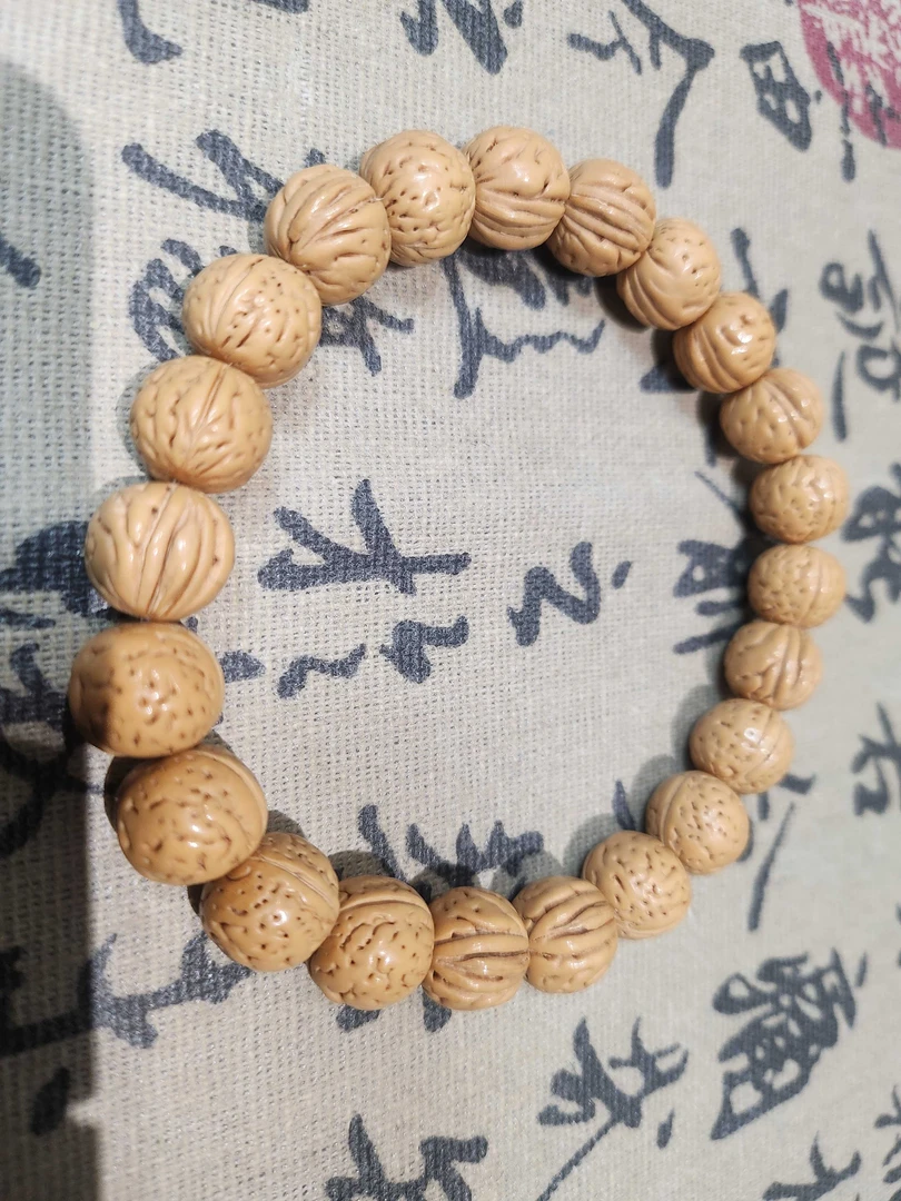 精品桃核手串奶油三道劲