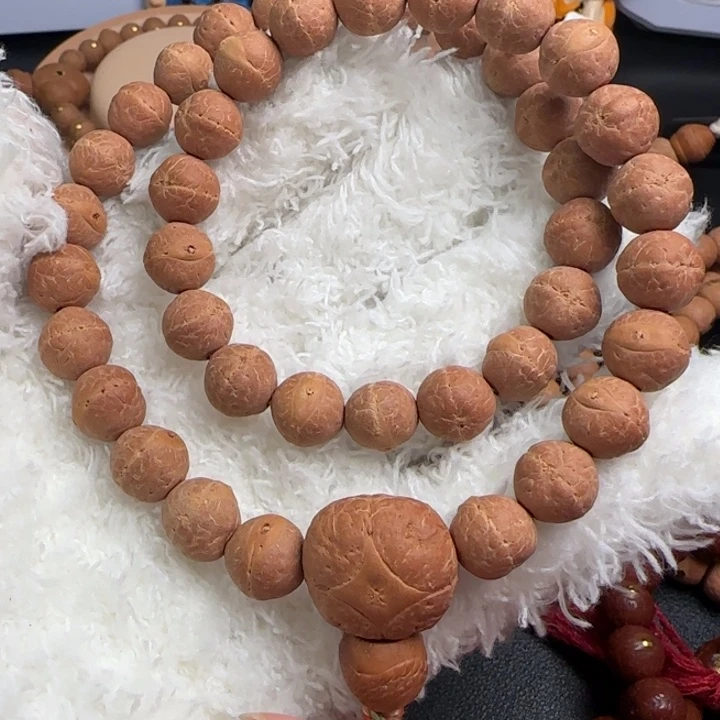 凤眼菩提吊坠10.5实心手持正圆大眼睛粉红皮树王