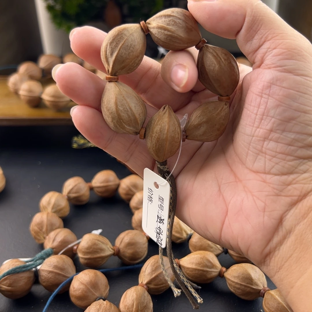 ****周橄榄核吊坠梅林铁核四花手捻