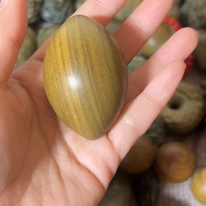 是***我木阿根廷绿檀个性手把件