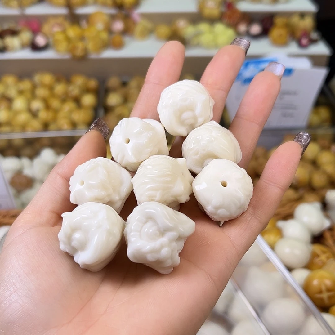 菩提根/象牙果吊坠瑕疵白醒狮4颗有裂