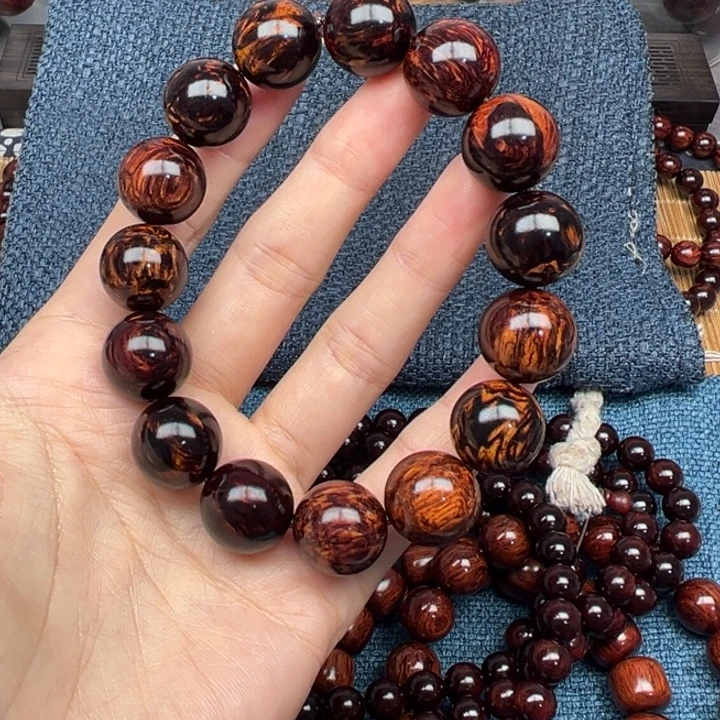 顺***木海南公交花梨公黑金玉化火焰纹1.5圆珠