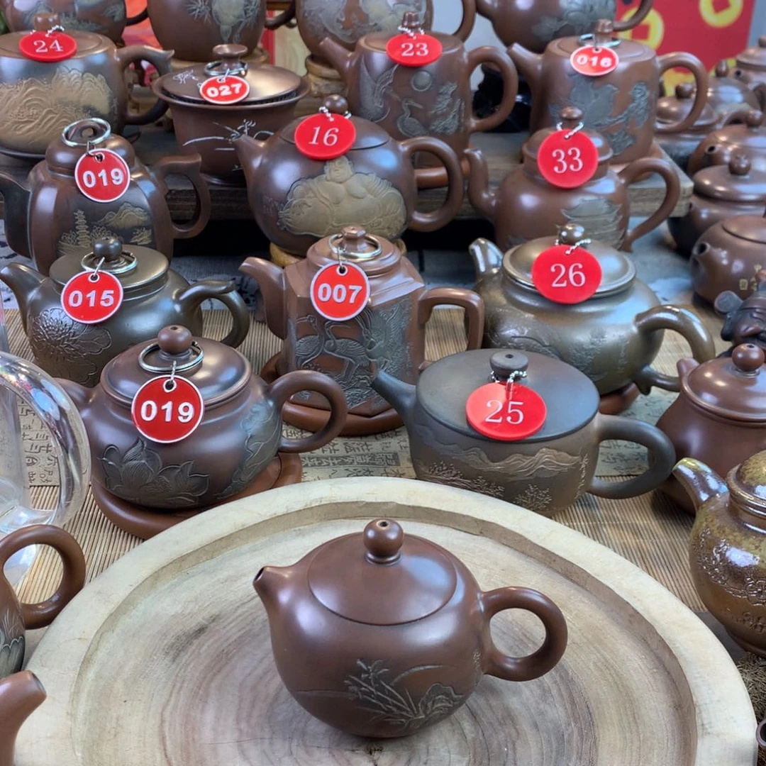 @**者坭兴陶手工刻绘兰花壶