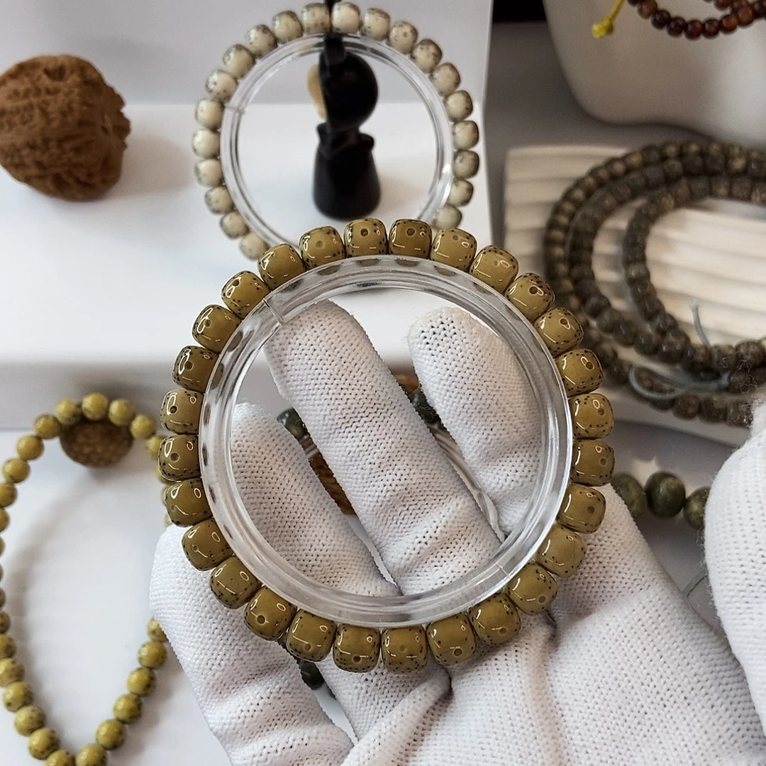 布***依手串星月菩提8鸡油黄大半壁63