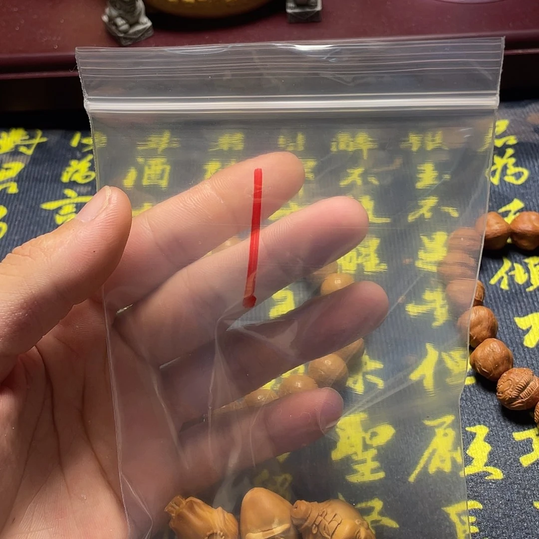 譩*®橄榄核雕刻瑕疵单籽