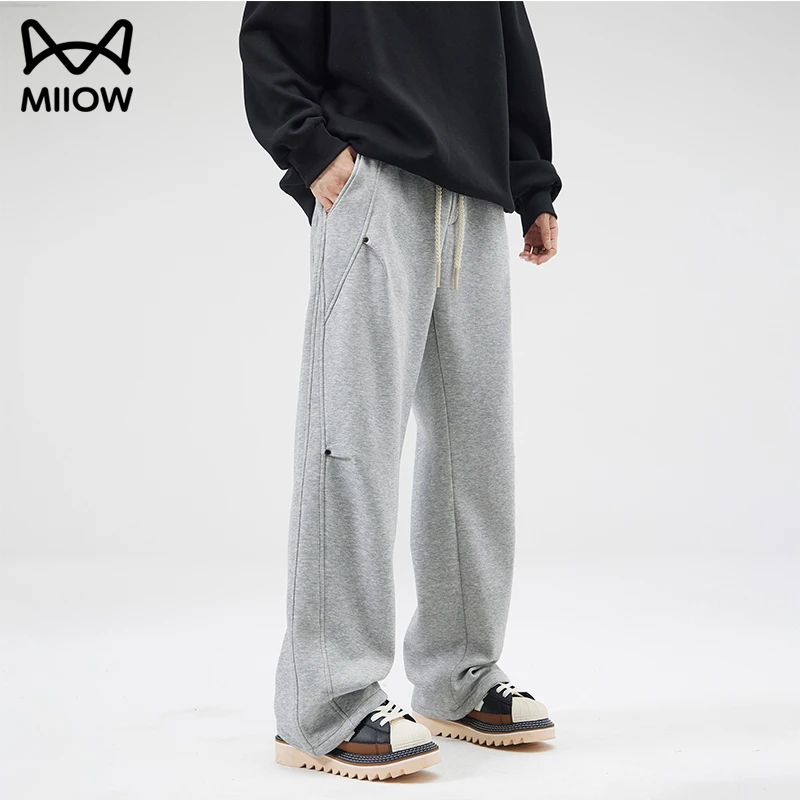 猫人高端铆钉不规则休闲裤男士秋冬季拼接设计感宽松直筒运动卫裤