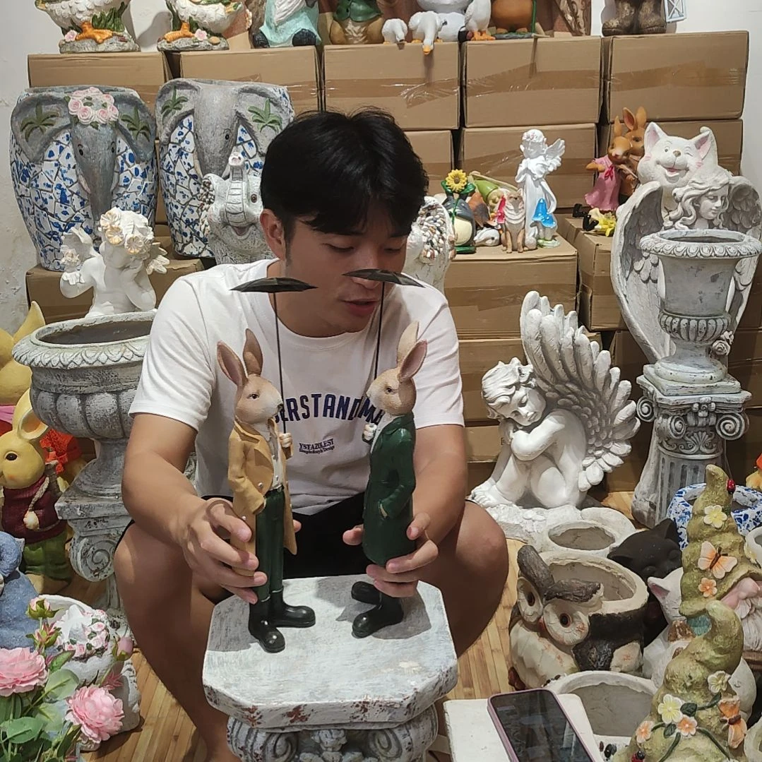 合成树脂打伞兔一对