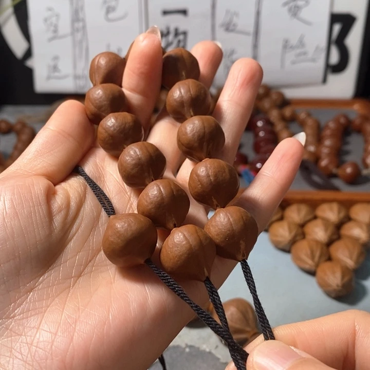 莽***夫橄榄核手串9171精品蒜头铁核12+1颗