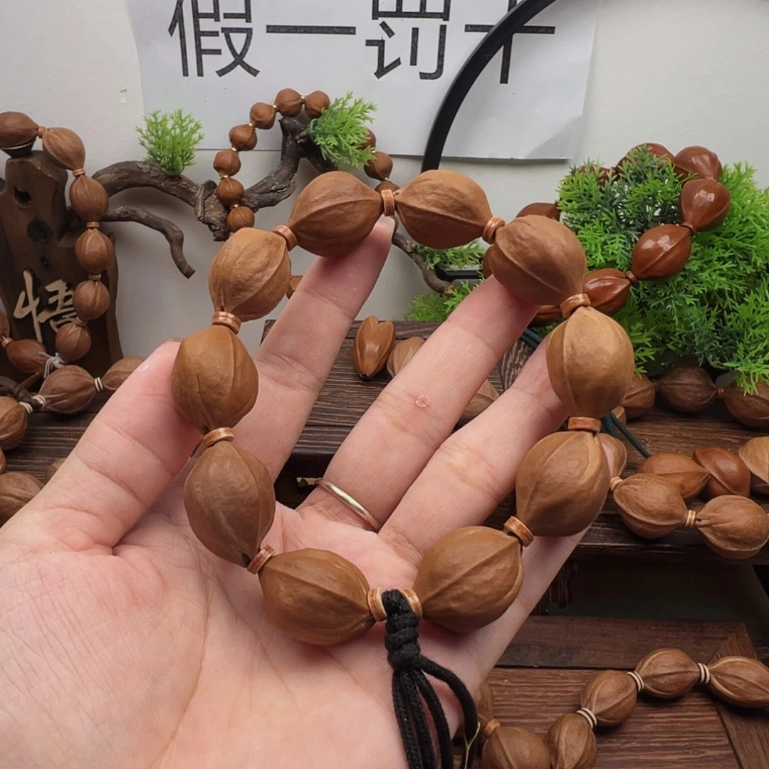 小***丑橄榄核手串18.24梅林铁核