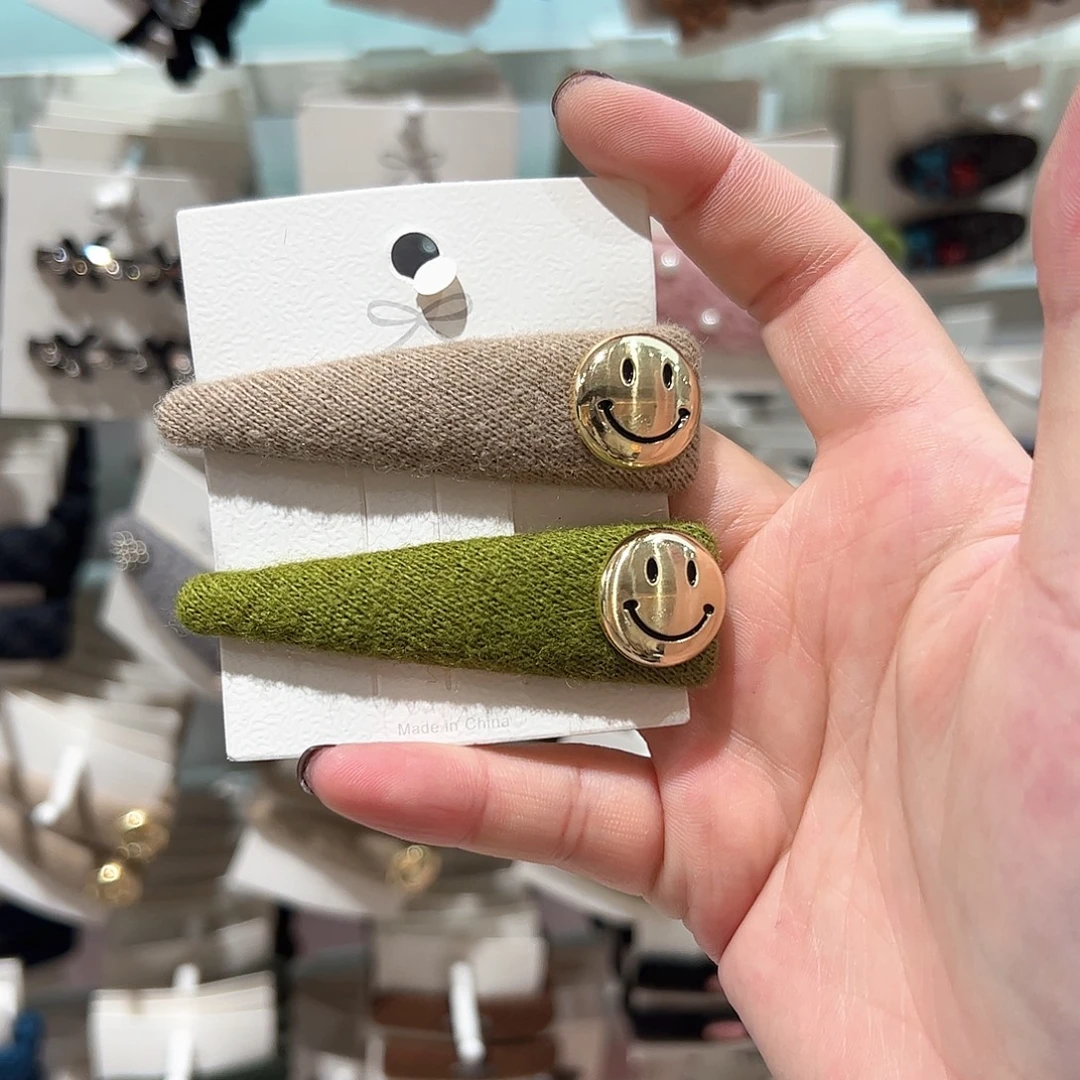 布艺非金属拼色笑脸拜拜夹