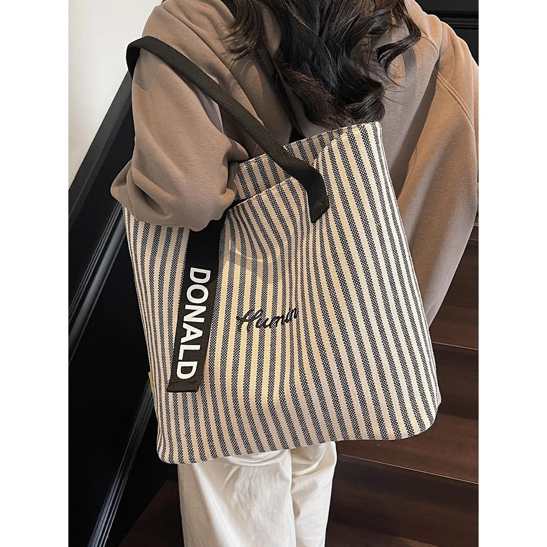 时尚休闲大容量托特包2025新款文艺百搭单肩包韩版高级感通勤女包