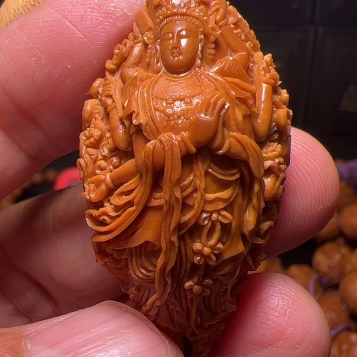 用***8橄榄核手串千手观音