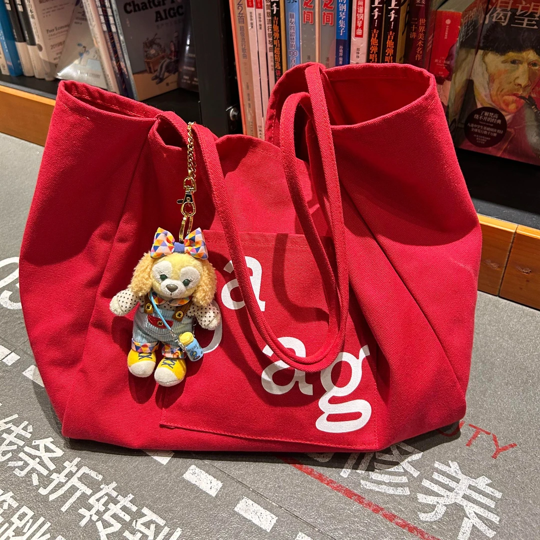 韩系慵懒风大容量红色字母帆布包2025新款百搭学生上课通勤托特包