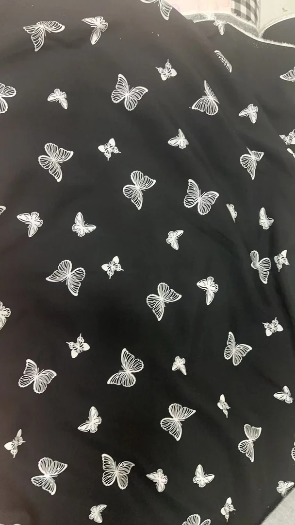 黑底白蝴蝶绵绸人造棉服装布料