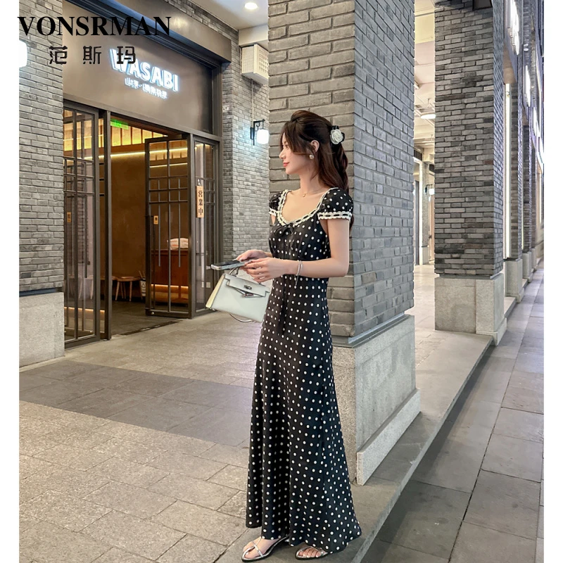 波点连衣裙女2025夏季新款高级感法式度假风收腰显瘦气质黑色长裙
