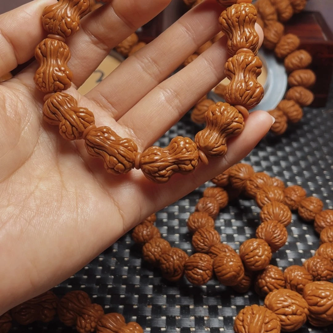 桃核手串我****边秦岭龙纹桃核