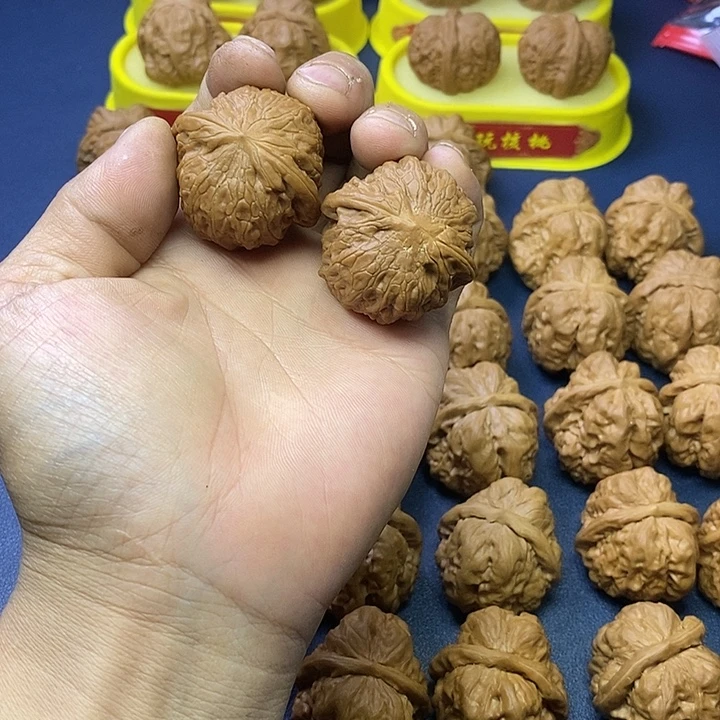 何***哉文玩核桃把件铁锤