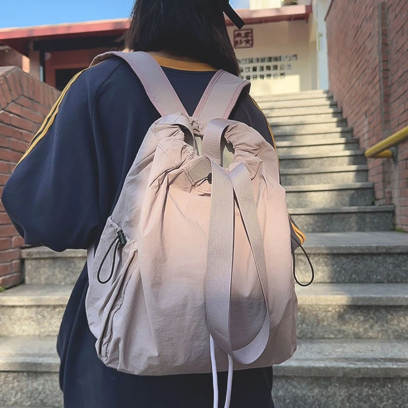 双肩包女2025新款抽绳束口袋轻便旅行运动背包小众设计男学生书包