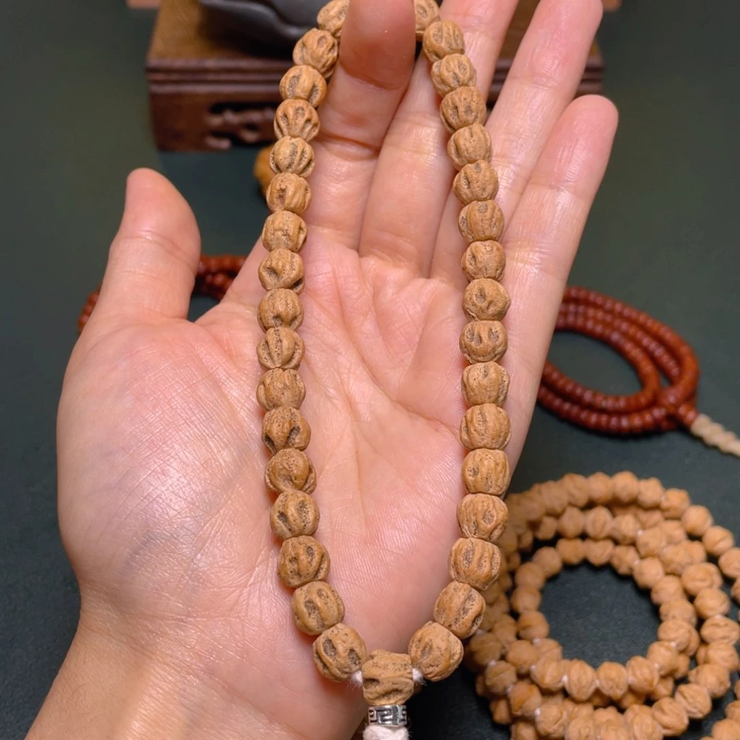 柏香籽/百香籽吊坠热双坑鬼手持