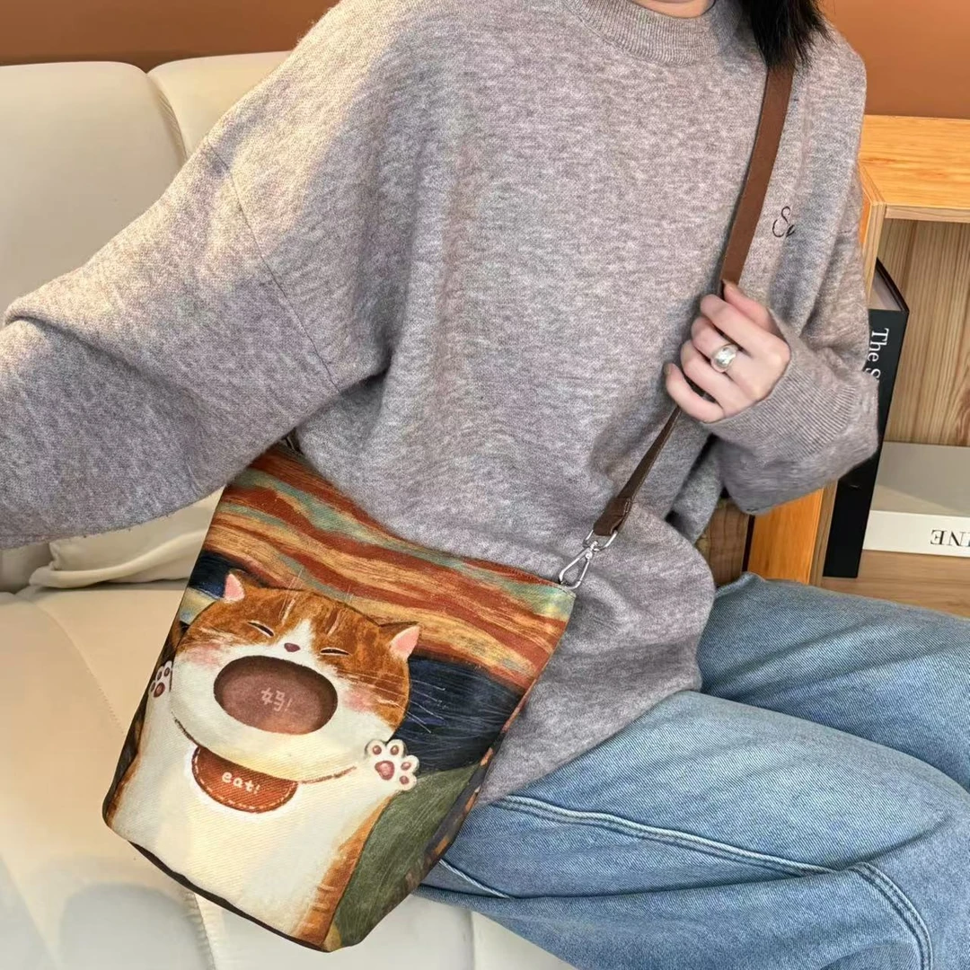 弘娜新款秋冬妈宝小胖橘细肩带斜挎水桶包单肩包可爱帆布包女AI