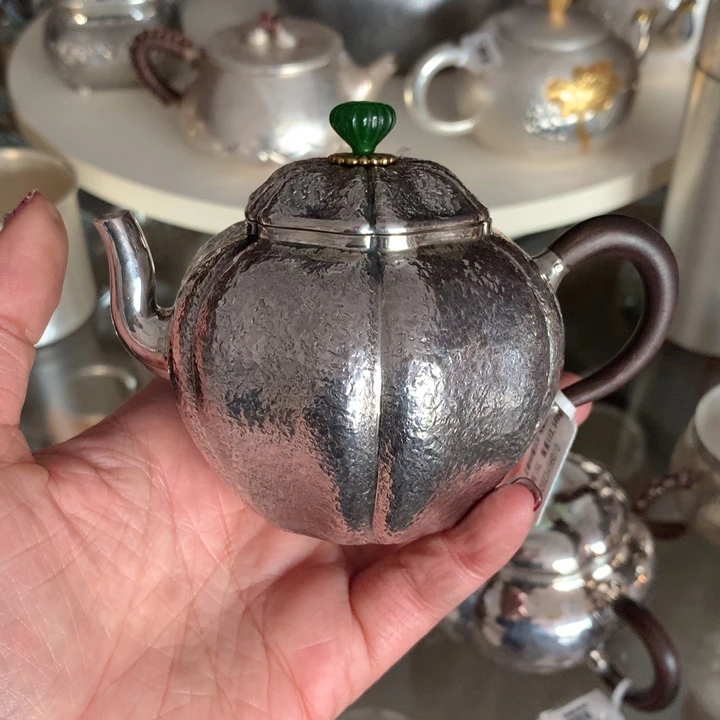 何*彤足银999瓜瓣小壶150容量