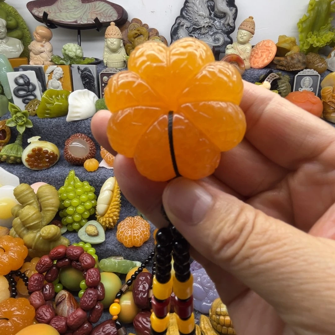 聪***语石材橘子手把件大吉大利