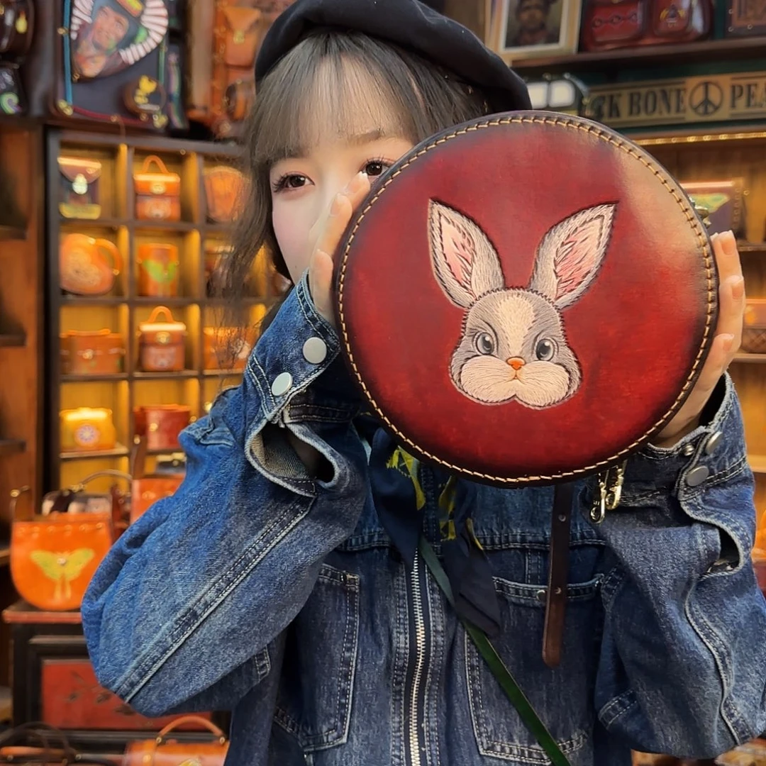梦***黄牛剖层皮革酒红兔子圆饼包