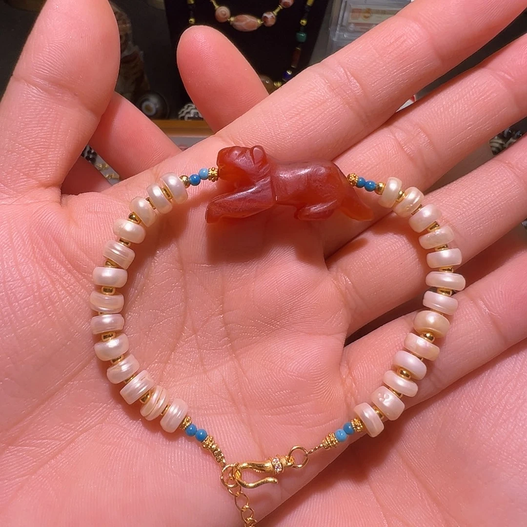 贾***岁树脂制品老虎手链