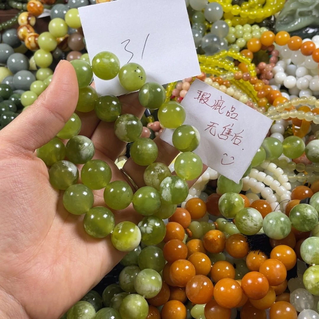 未镶嵌蛇纹石玉手串寒*瘋